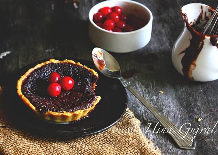 Chocolate Truffle Tart is oh-so-decadent tart, made with chocolate and cream well worth the calorie splurge. Find tart recipe