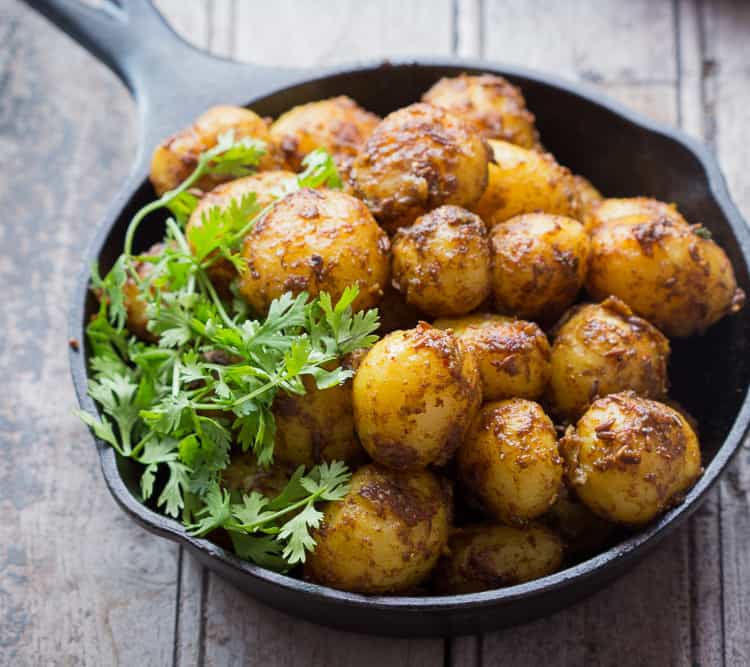 Bombay Potatoes Recipe (Masala Aloo) is the best ever Indian-style roasted potato recipe. Learn how to make Bombay Potatoes in few simple steps