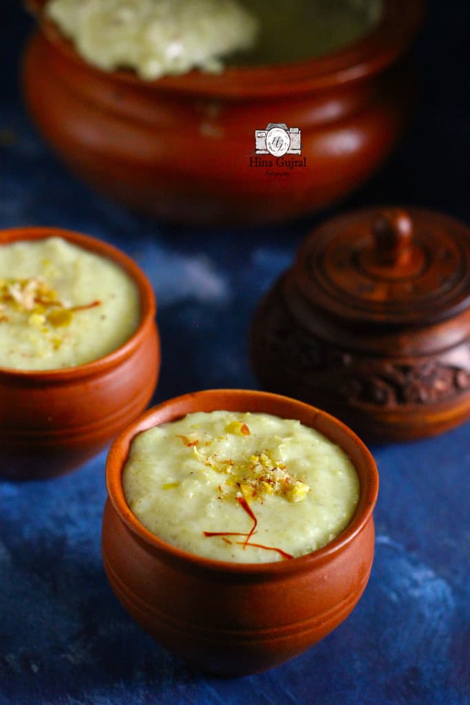 side shot of firni in an wooden bowl