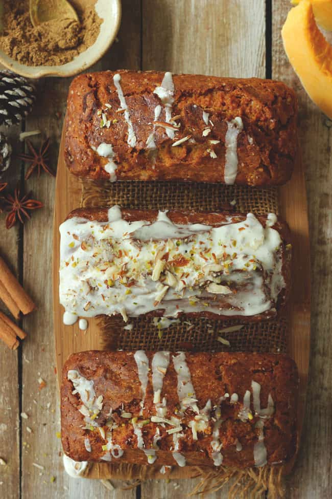 aerial shot of mini pumpkin loaf cake arranged on a wooden platter