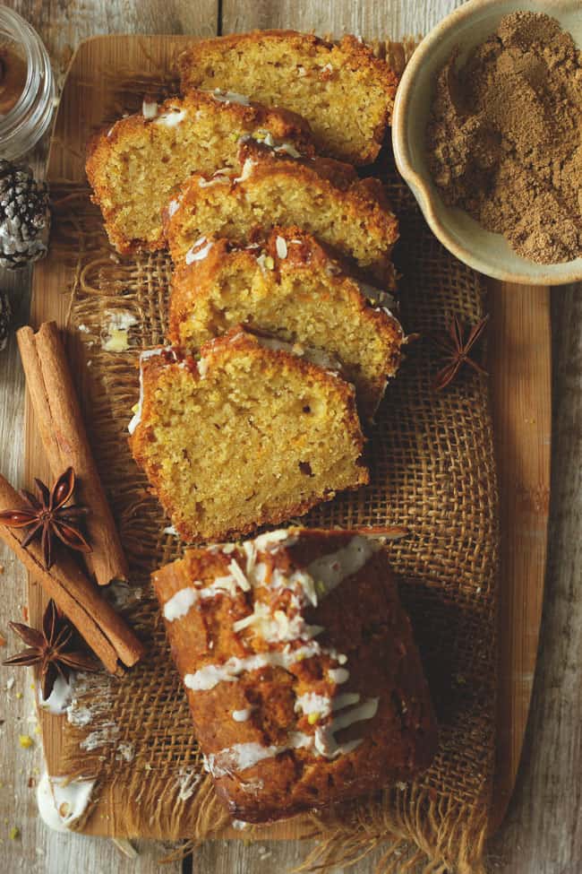 aerial shot of sliced pumpkin cake on a wooden board