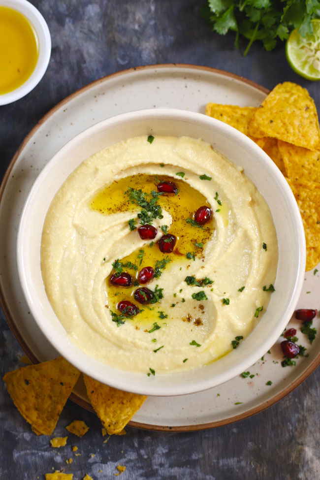 aerial shot of hummus in a white ceramic bowl