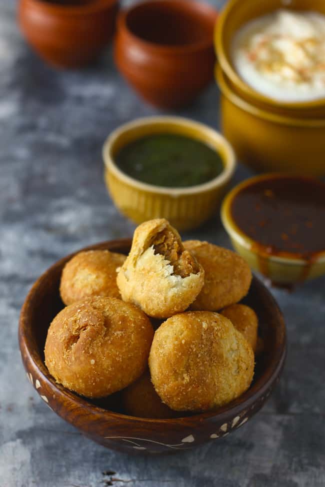 Side Shot of Khasta Kachori in a wooden bowl