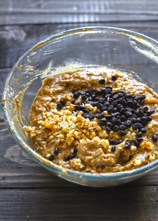 side shot of date bread batter in a glass mixing bowl