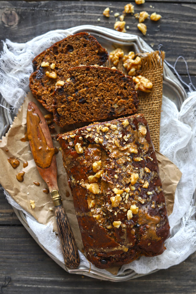 aerial shot of eggless date bread on a vintage serving plate