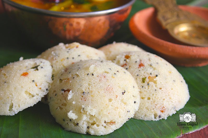 close up side shot of instant suji idli on a banana leaf