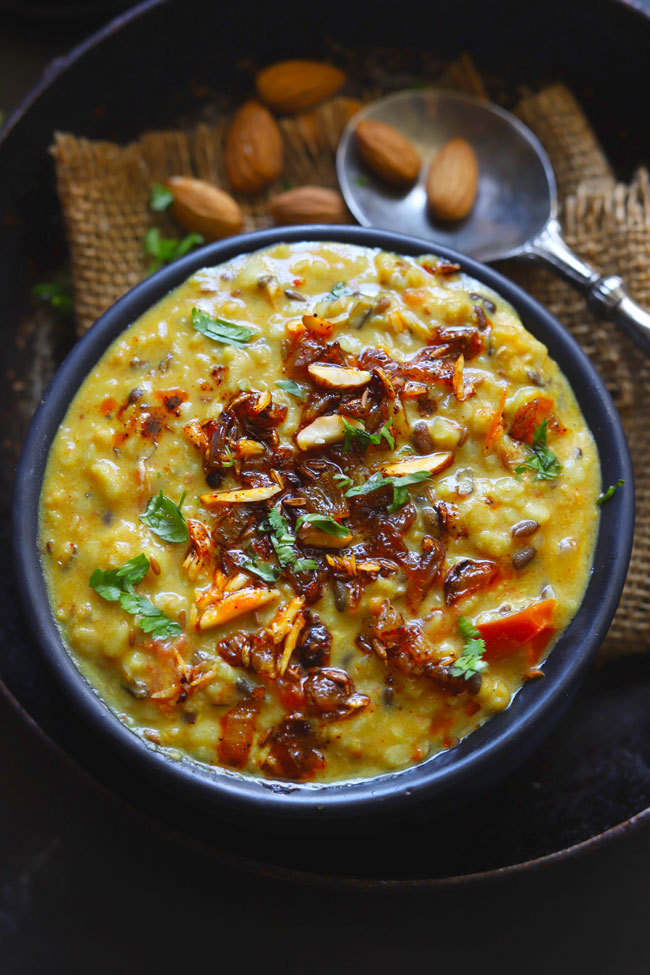 Aerial shot of shahi urad dal in a black bowl. 