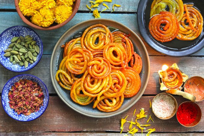 aerial shot of jalebi stacked in a black platter