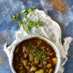 aerial shot of pahadi aloo paani in a vintage serving bowl