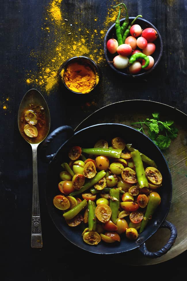 aerial shot of karonde ki sabzi in a cast iron kadhai