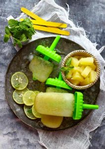 You need 5 ingredients - pineapple, mint, juice, sugar and chaat masala, to make these delicious mint and pineapple popsicles.