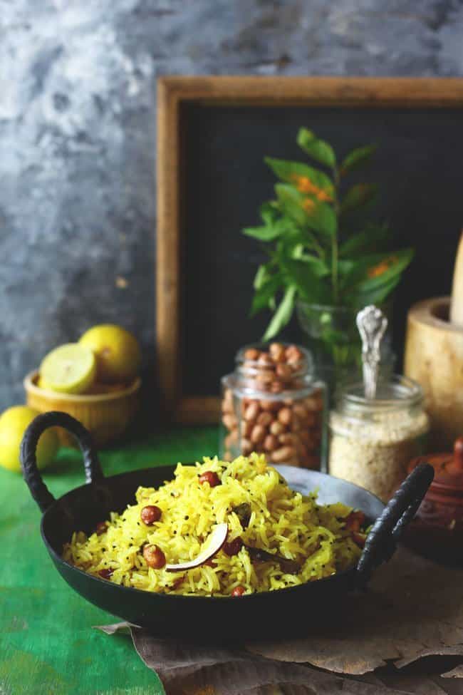 side shot of lemon rice in a cast iron kadhai