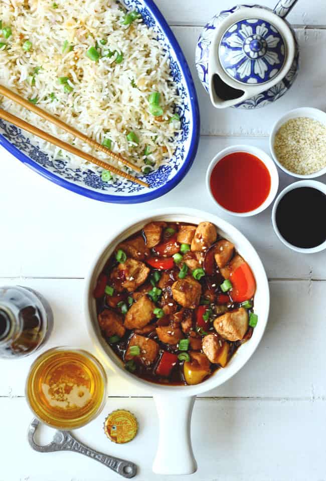 aerial shot of kung pao chicken served on a white ceramic pan