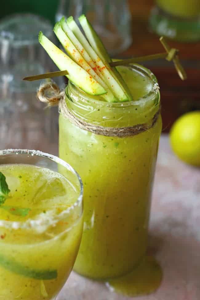 Aam Panna is a natural Indian coolant prepared with raw mango pulp, sugar, spices, and mint leaves.