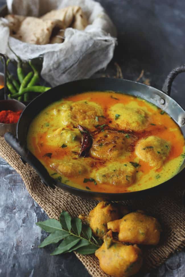 Kadhi Pakora is a gluten-free Indian curry prepared with gram flour and yogurt (curd).