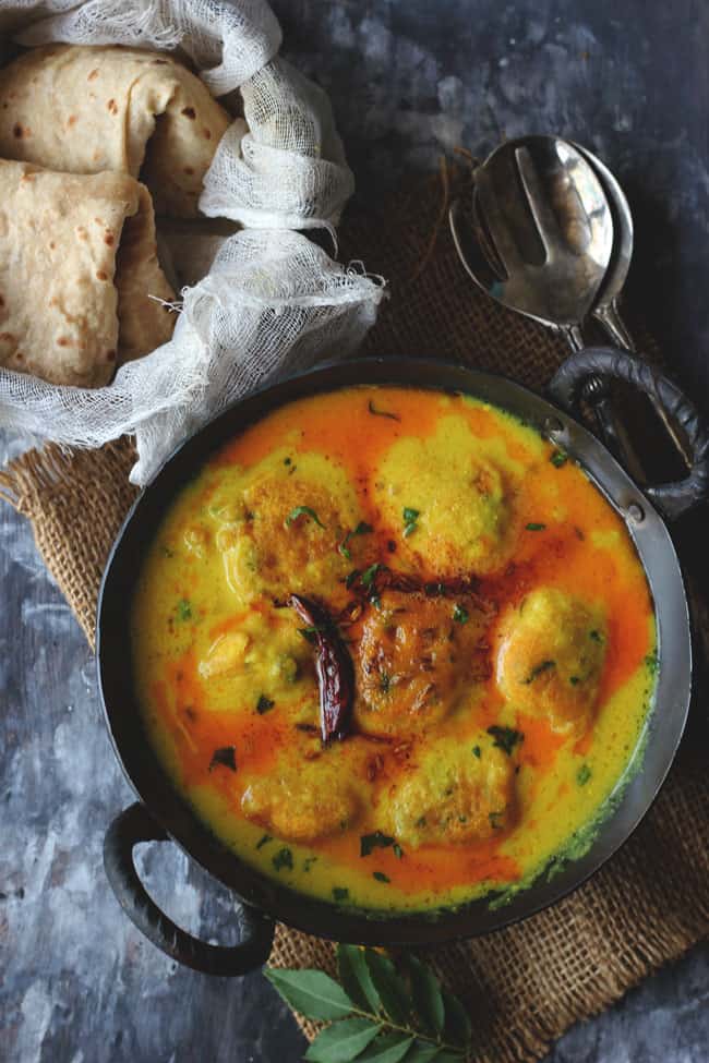 Kadhi Pakora is a gluten-free Indian curry prepared with gram flour and yogurt (curd).