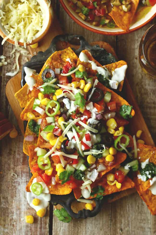 aerial shot of loaded veggies nachos on a platter