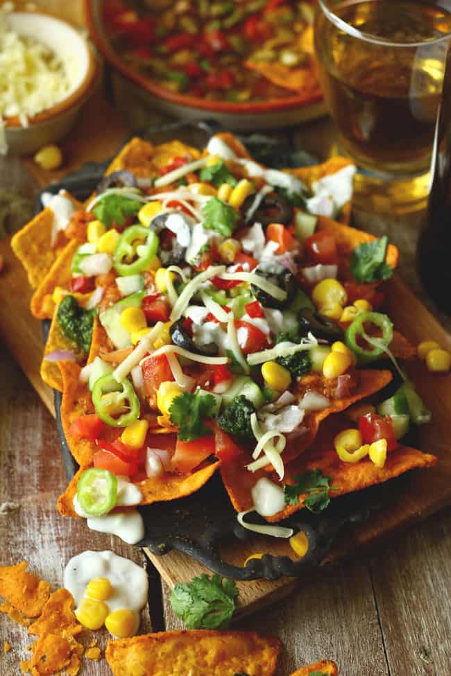 side shot of loaded nachos in a platter