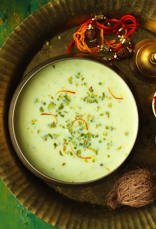 aerial shot of lauki kheer in a brass serving bowl