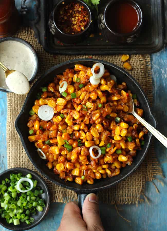 aerial shot of crispy corn on a cast iron skillet