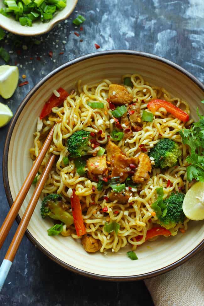 aerial shot of stir fry chicken maggi noodles in a ceramic bowl