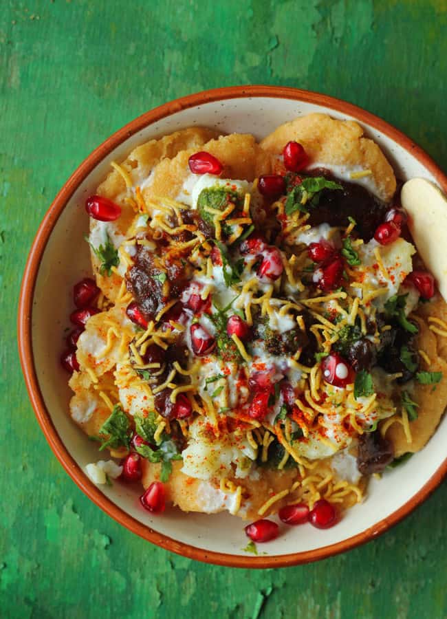 aerial shot of dahi papdi chaat in a cream color ceramic platter