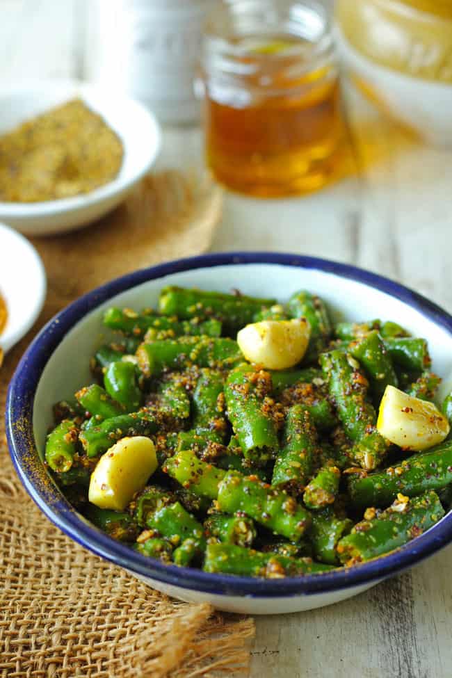 side shot of chilli pickle in a white bowl