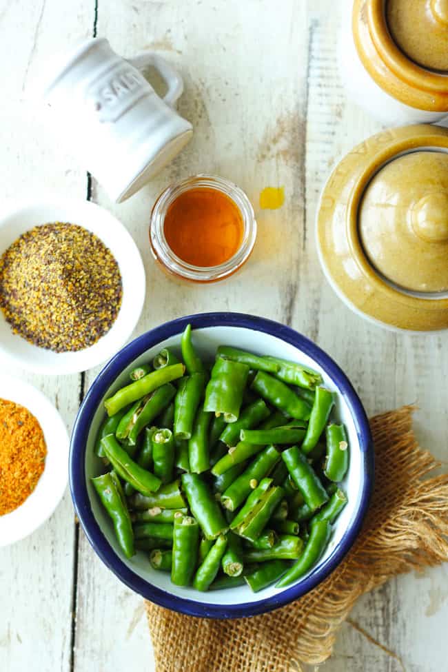 aerial shot of ingredients for green chilli pickle