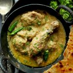 aerial shot of Indian chicken korma curry in a kadhai
