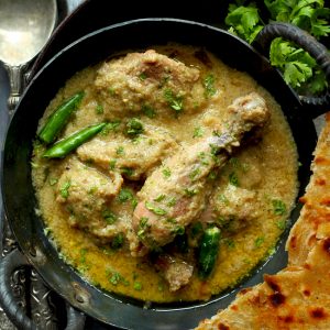 aerial shot of Indian chicken korma curry in a kadhai