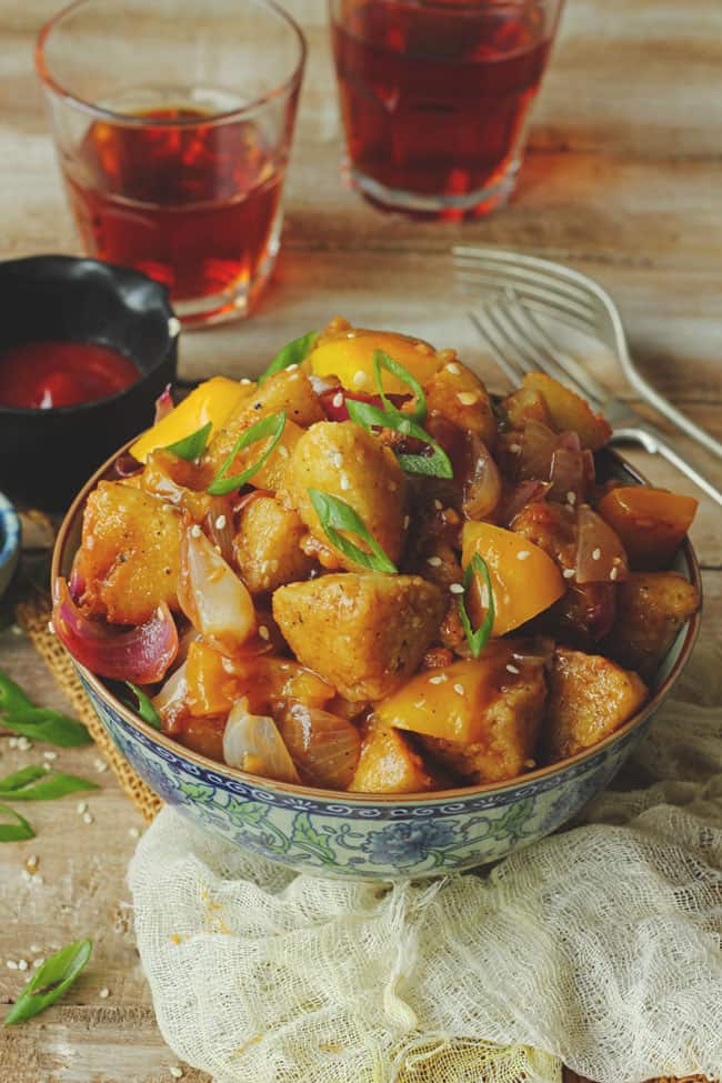 side shot of chilli idli in a bowl