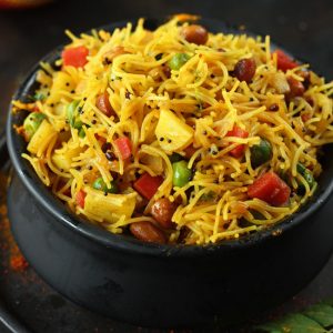 side close up shot of semiya upma in a black serving bowl