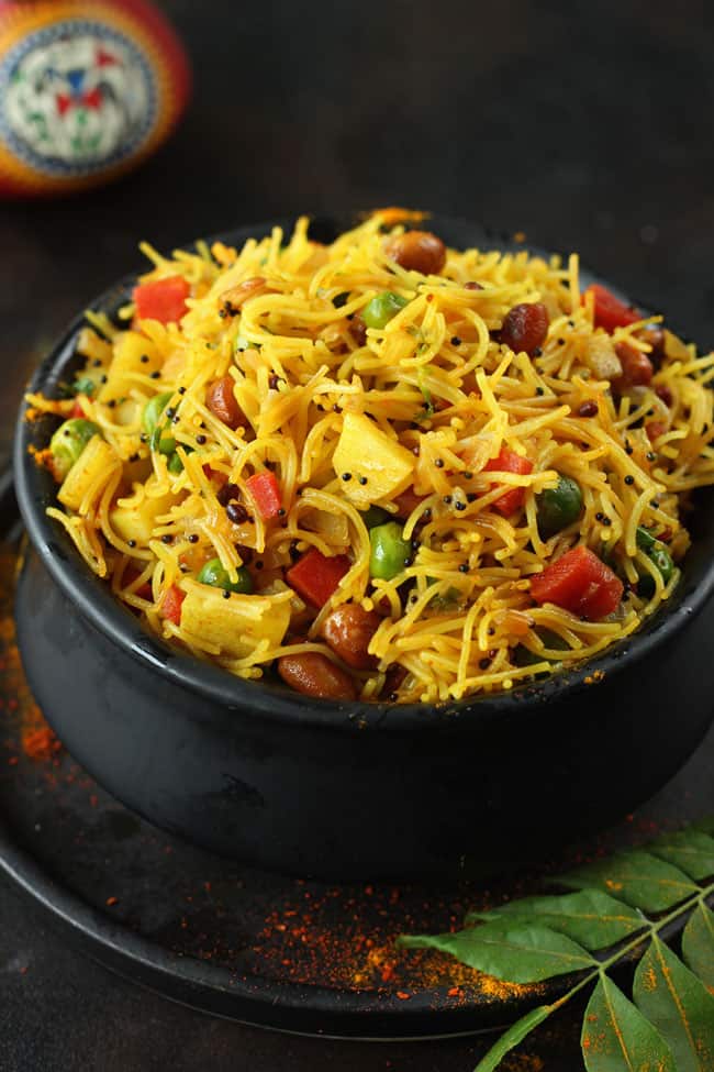 side close up shot of semiya upma in a black serving bowl