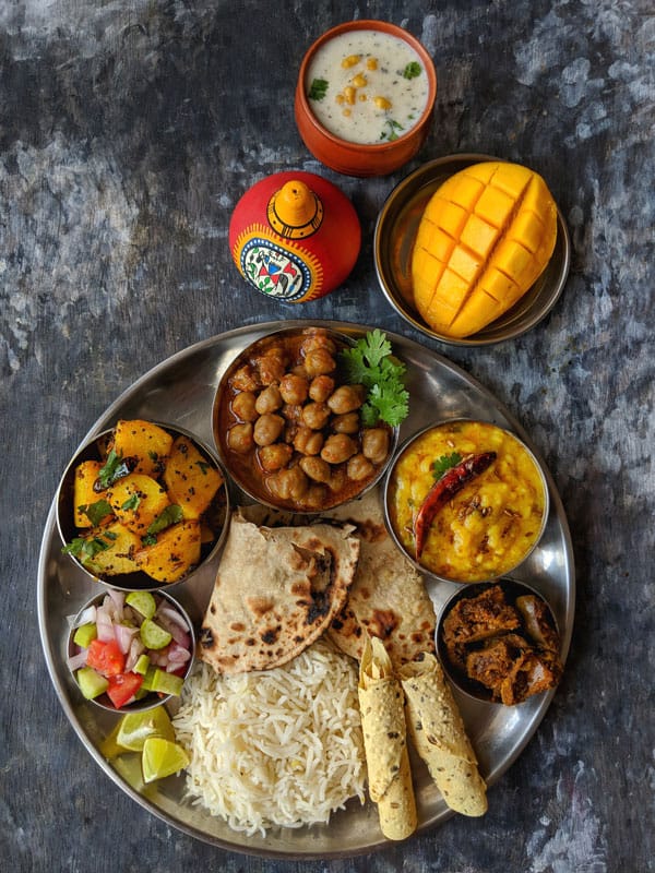 aerial shot of Indian thali on a black surface