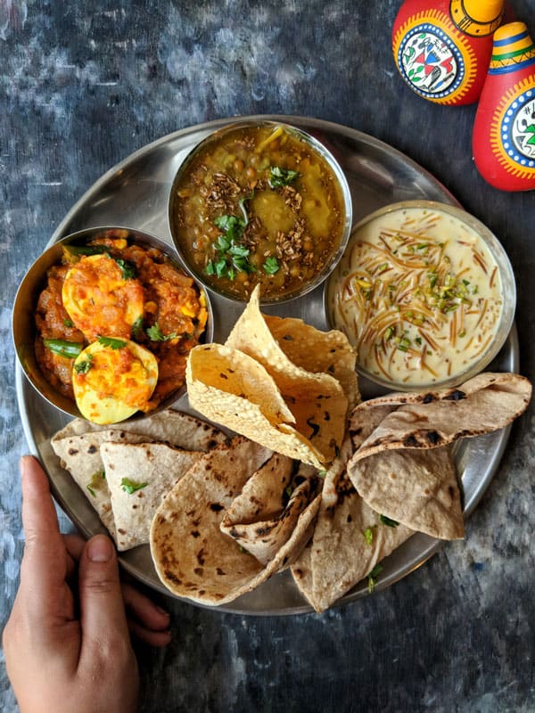 aerial shot of Indian thali on a black surface