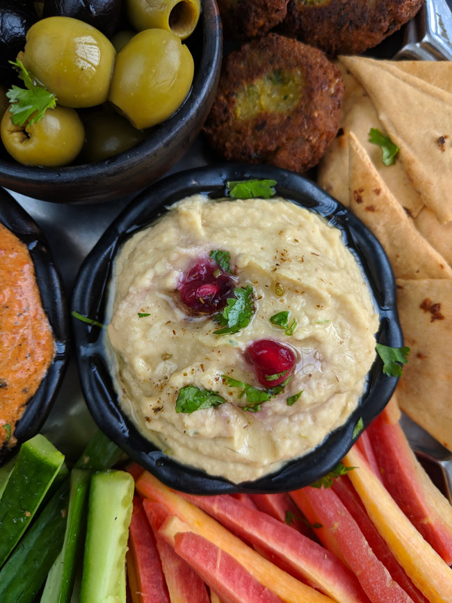 aerial close up shot of hummus in a mezze platter