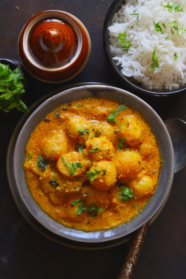 Dum Aloo is a curried baby potato in a vegetarian and gluten-free Mughlai style gravy.