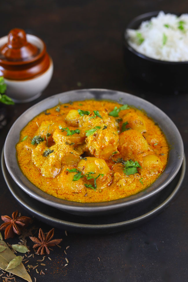 Dum Aloo is a curried baby potato in a vegetarian and gluten-free Mughlai style gravy.