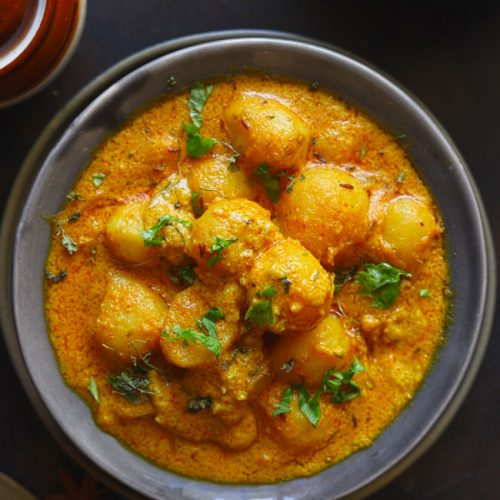 Dum Aloo is a curried baby potato in a vegetarian and gluten-free Mughlai style gravy.