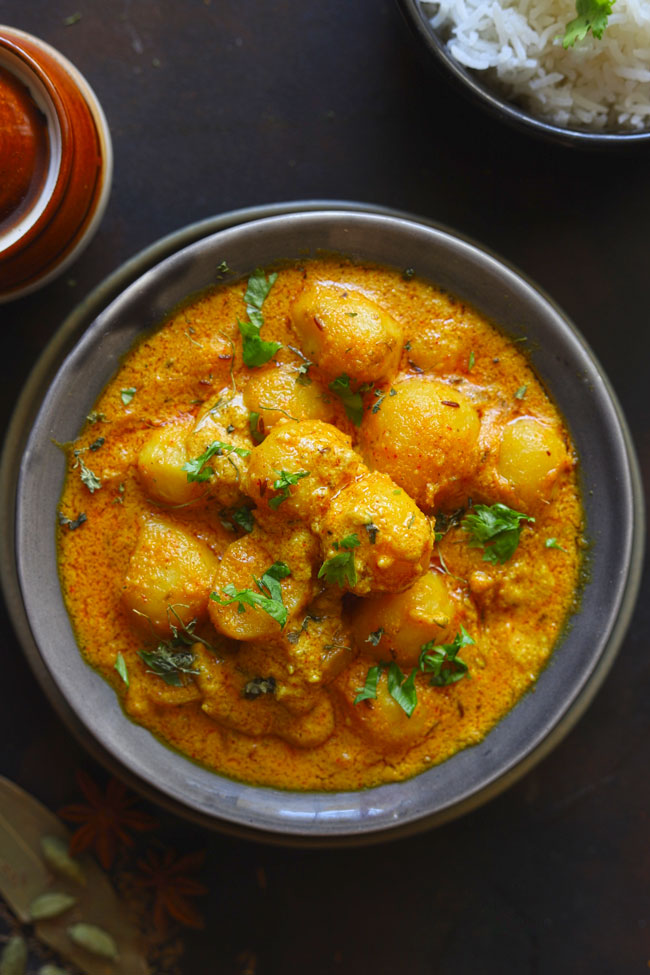 Dum Aloo is a curried baby potato in a vegetarian and gluten-free Mughlai style gravy.