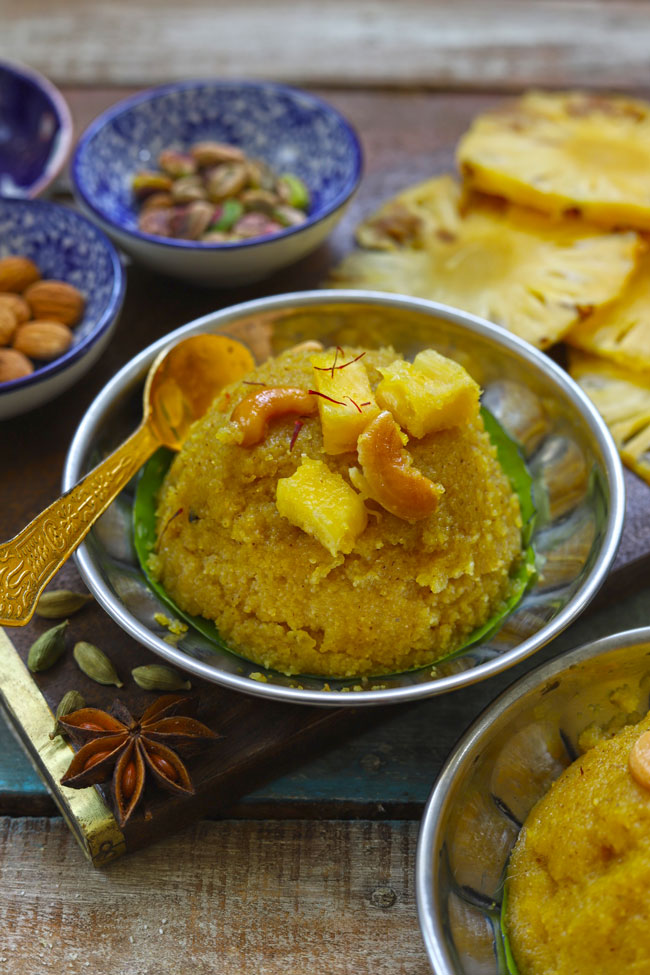 side close up shot of pineapple kesari bhaath in a steel serving bowl