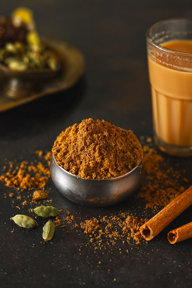 side shot of Indian masala tea powder in a stainless steel bowl