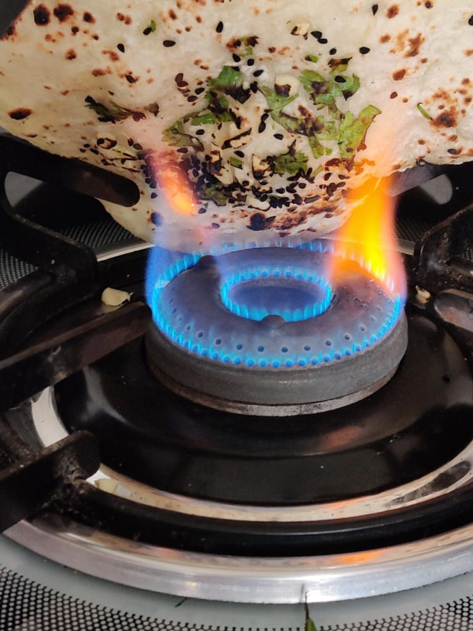 Naan Bread Cooking On a Gas Stove Flame