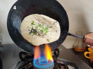 Naan Cooking Over The Gas Stove Direct Flame