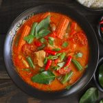 Thai Red Chicken Curry In A Black Bowl