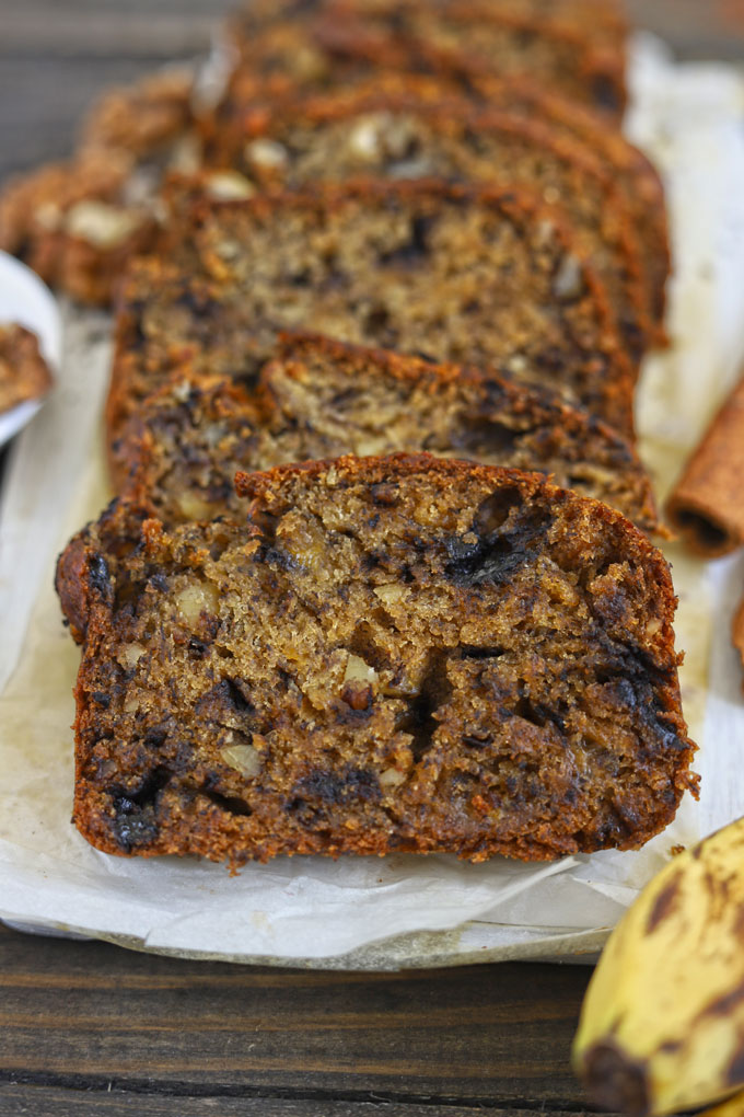 Slices of banana bread on a white platter.