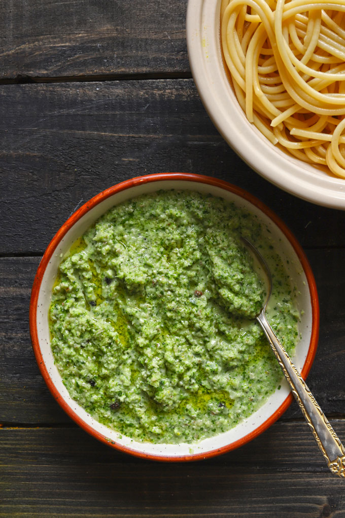 aerial shot of broccoli pesto in a ceramic bowl