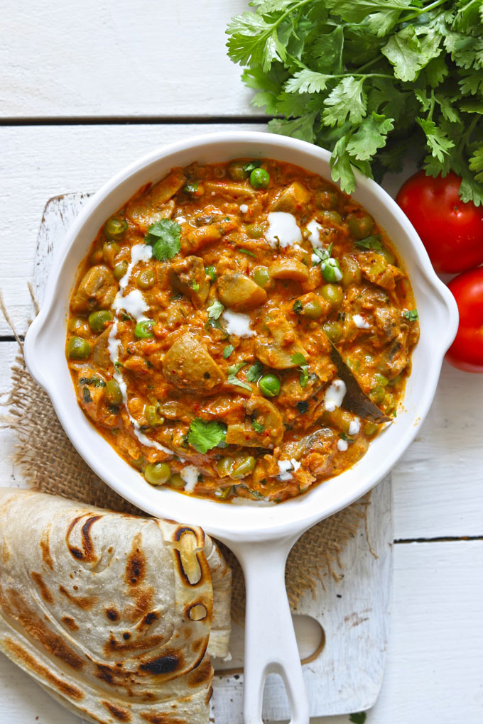 Aerial shot of Indian mushroom masala in a white pan