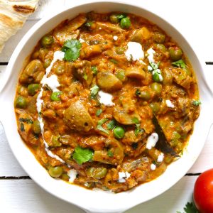 Aerial shot of Indian mushroom masala in a white pan