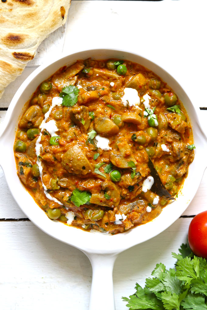 Aerial shot of Indian mushroom masala in a white pan